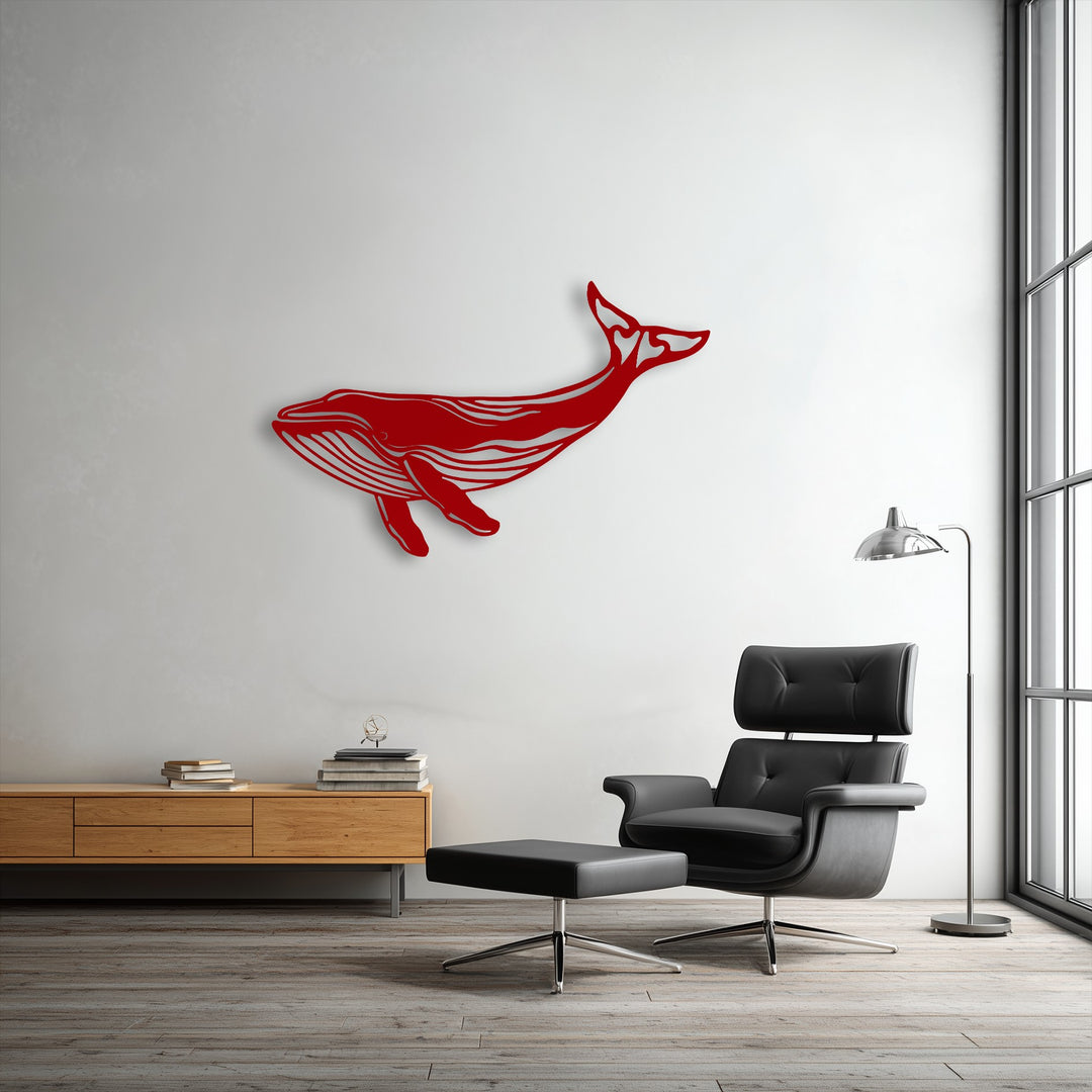 The realistic detail of the striking red whale metal wall decor captures the majestic ocean-inspired silhouette on the modern living room wall.
