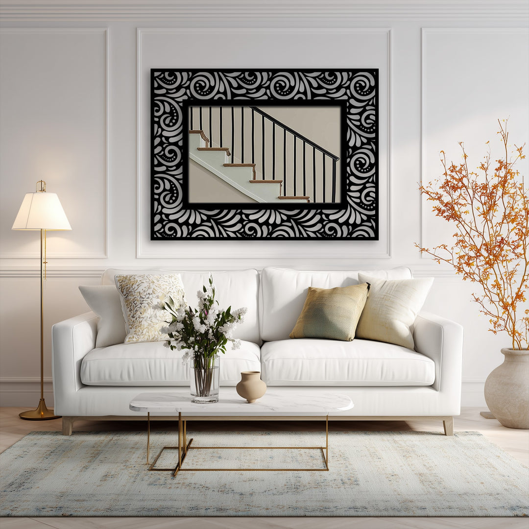 Showcasing the layering effect, this ornate floor mirror, framed with black metal artwork and floral scrolls, adds depth to the interior.