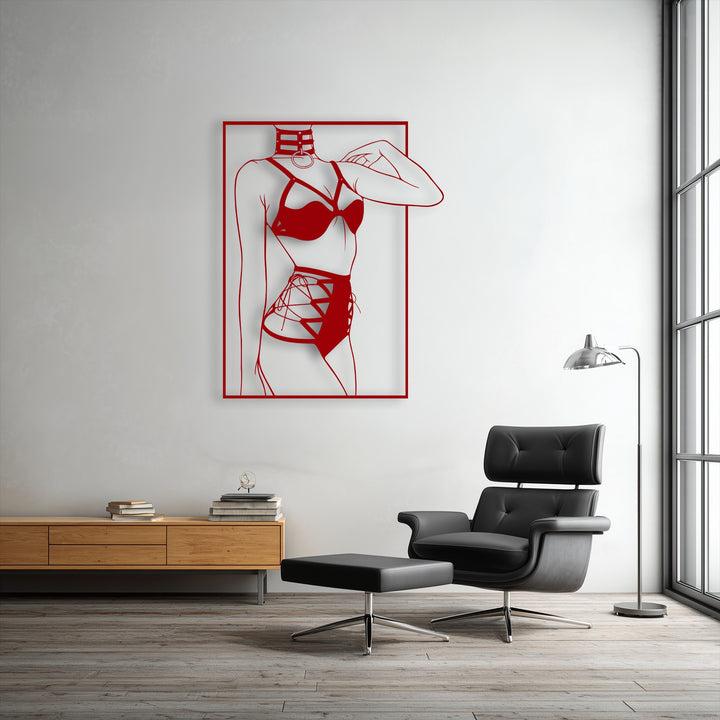 The subtly textured white wall and light hardwood floor, bathed in natural light, create a bright, contemporary background for the unique metal wall art.