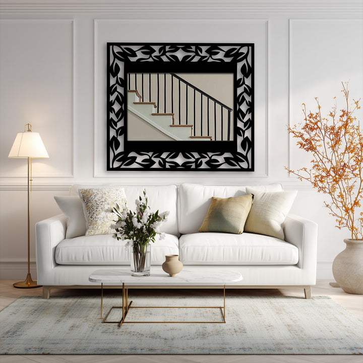 Evoking a serene and sophisticated mood, the leaf pattern frame around the metal artwork wall mirror adds an elegant botanical touch to the room's decor.