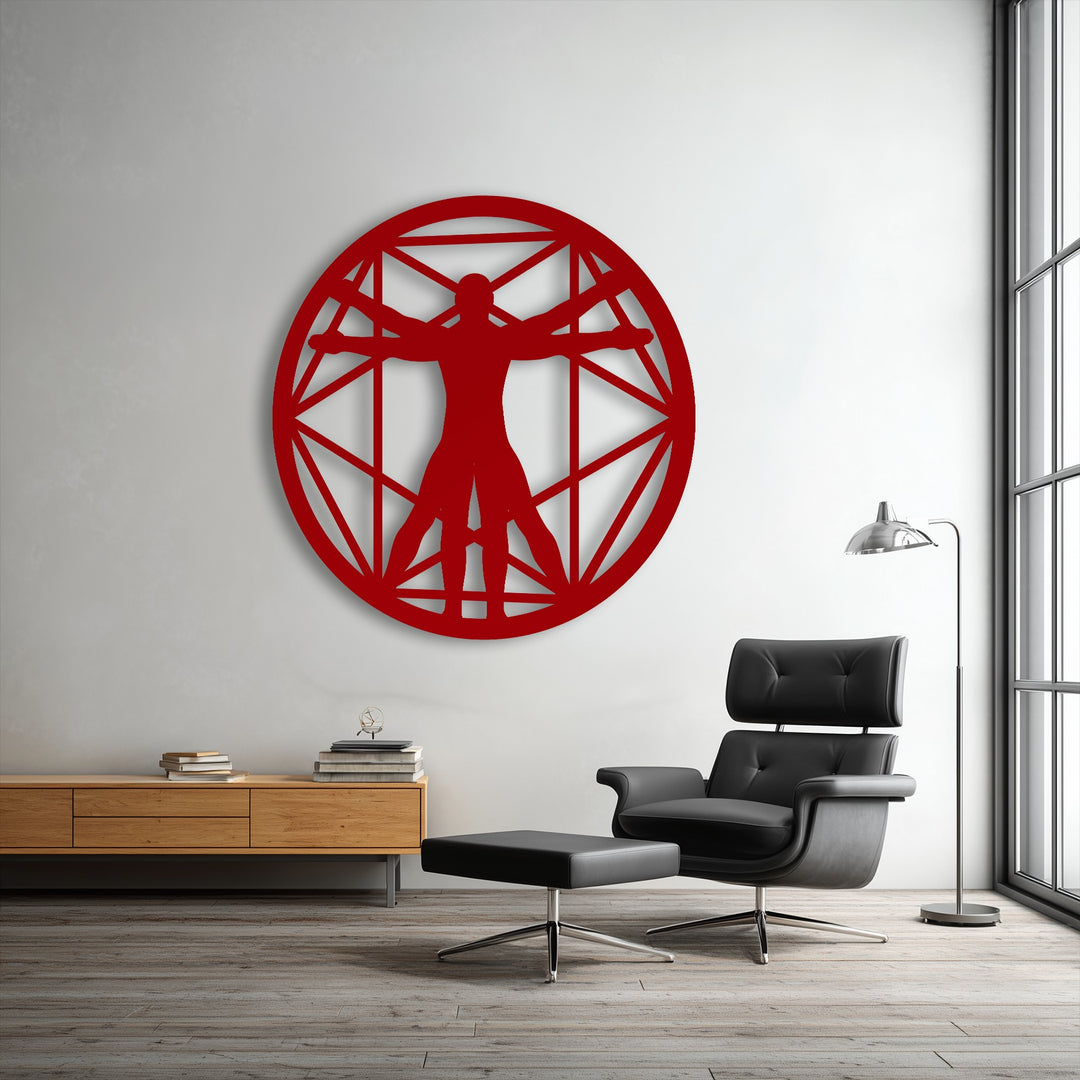The background shows a textured white wall, creating a clean backdrop for the prominent red Vitruvian Man geometric circle metal art for wall.