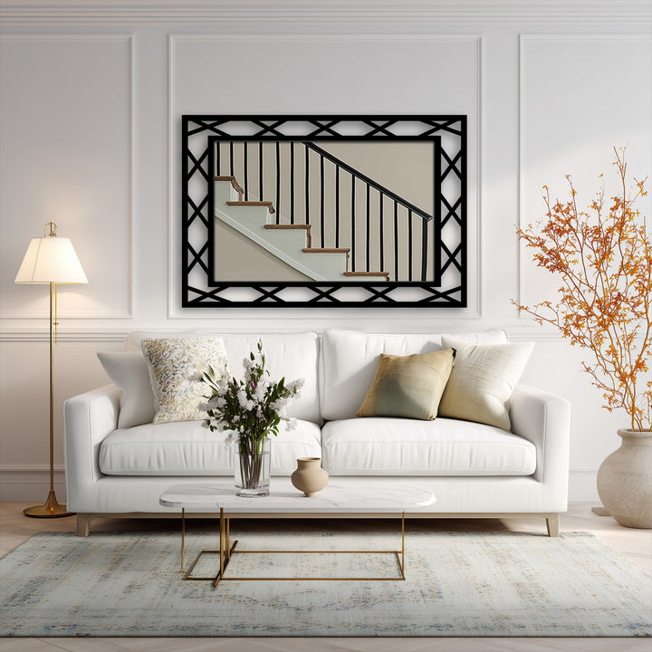Juxtaposing the angular, dark diamond lattice of the metal framed wall mirror against the stairwell art creates a compelling display of organic forms.