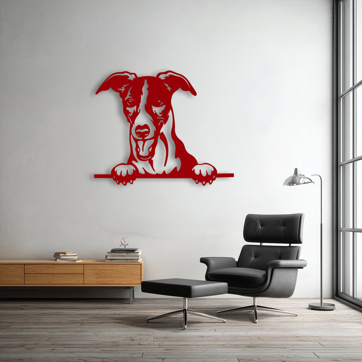 The cool color temperature of the brightly lit room highlights the striking red unique metal wall art of a curious puppy peeking.