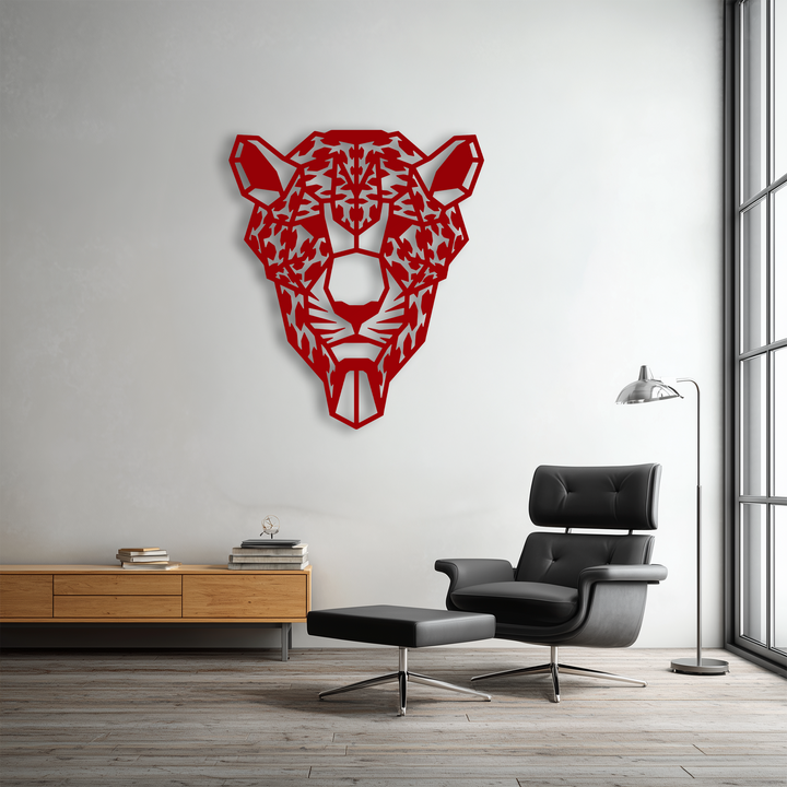 A sleek black leather armchair and matching ottoman furnish the foreground, below striking red Geometric Tiger Head decorative metal art.
