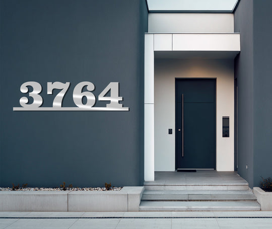 Showcasing the exquisite material quality, these modern address numbers exemplify decorative metal art, featuring a horizontal, floating design perfect for contemporary homes.