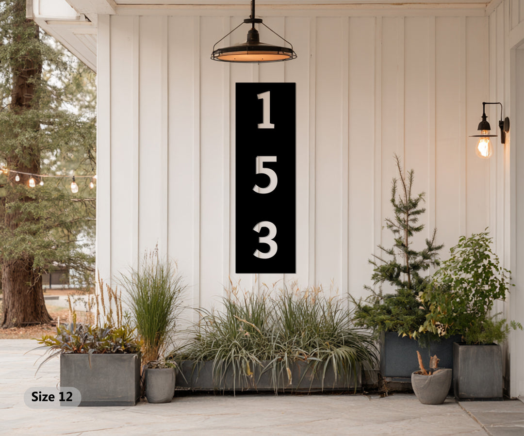 Black vertical metal house number decor