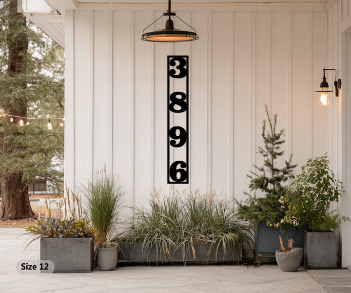 Black framed vertical metal house number display