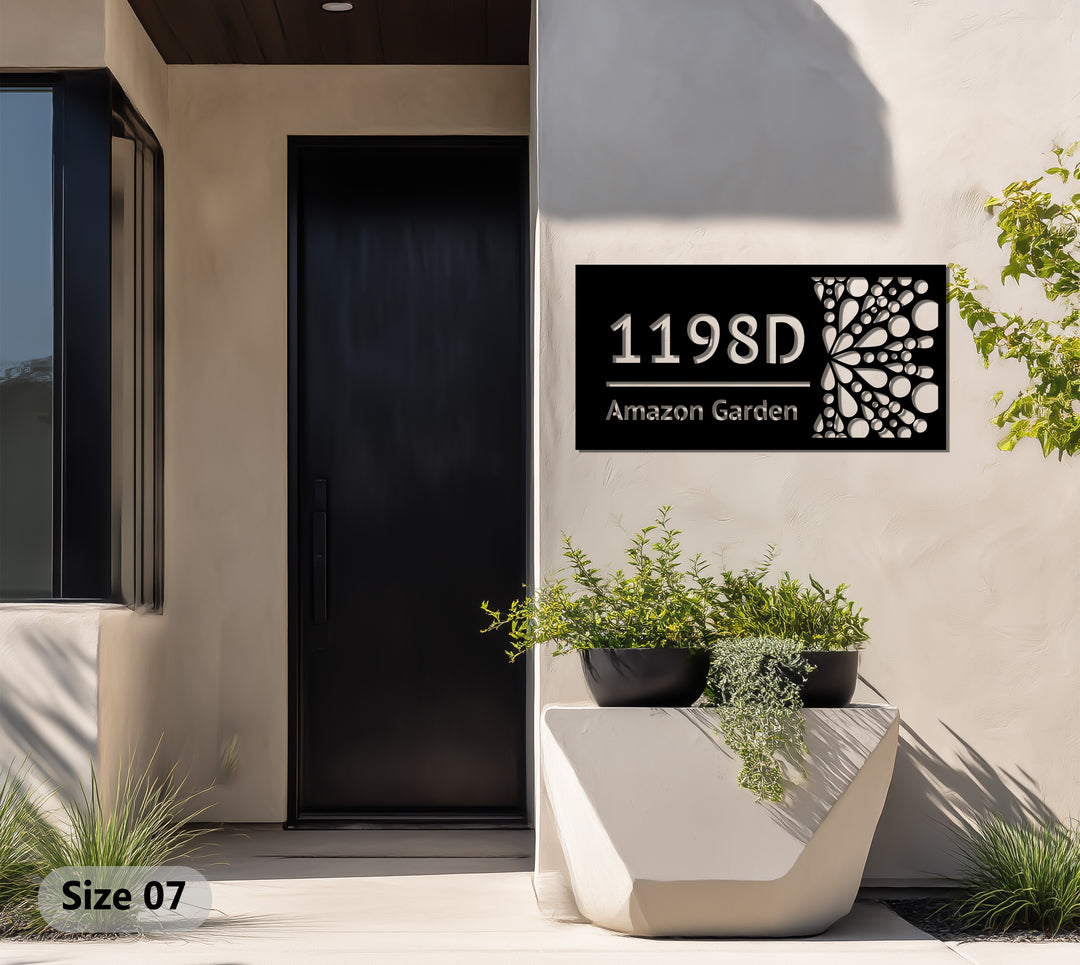 Modern black metal house sign with abstract dots