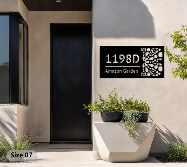 Modern black metal house sign with abstract dots