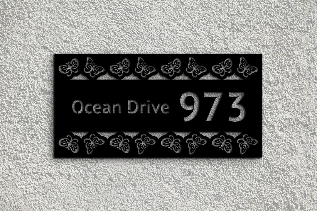 Modern black metal house number butterfly design