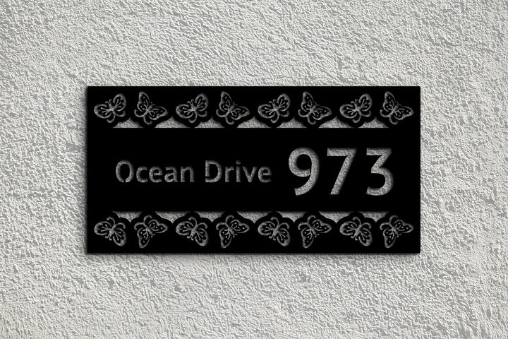 Modern black metal house number butterfly design