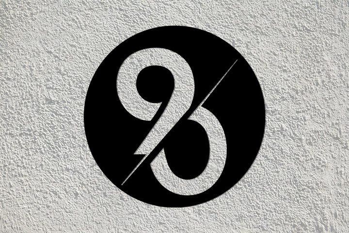 Bold typography circular metal wall sign