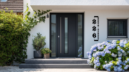 Defined by its precise edge and borders, this modern address display showcases striking metal artwork for a house number sign.
