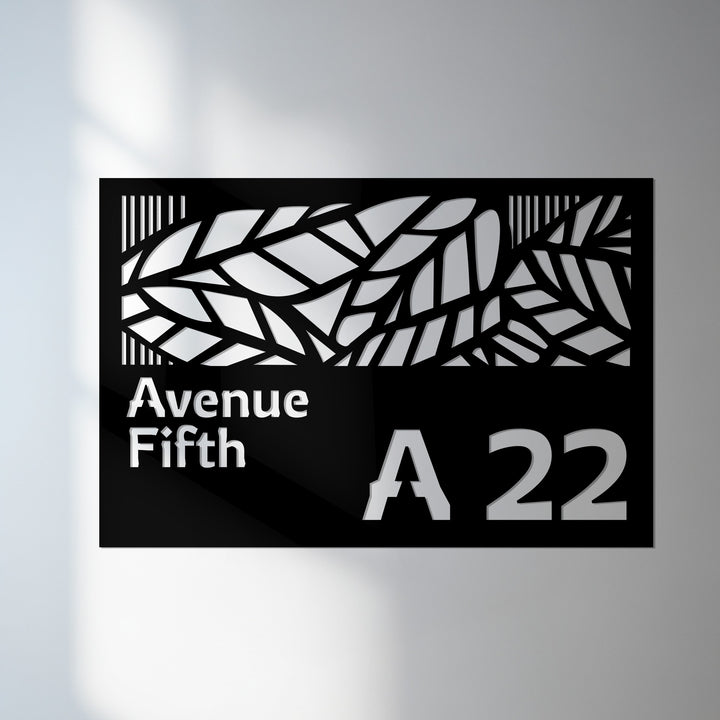 Decorative leaf metal house number sign with street name