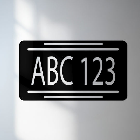Dramatic color contrast showcases the decorative metal art and personalized alphanumeric details of this modern horizontal metal house number plate.