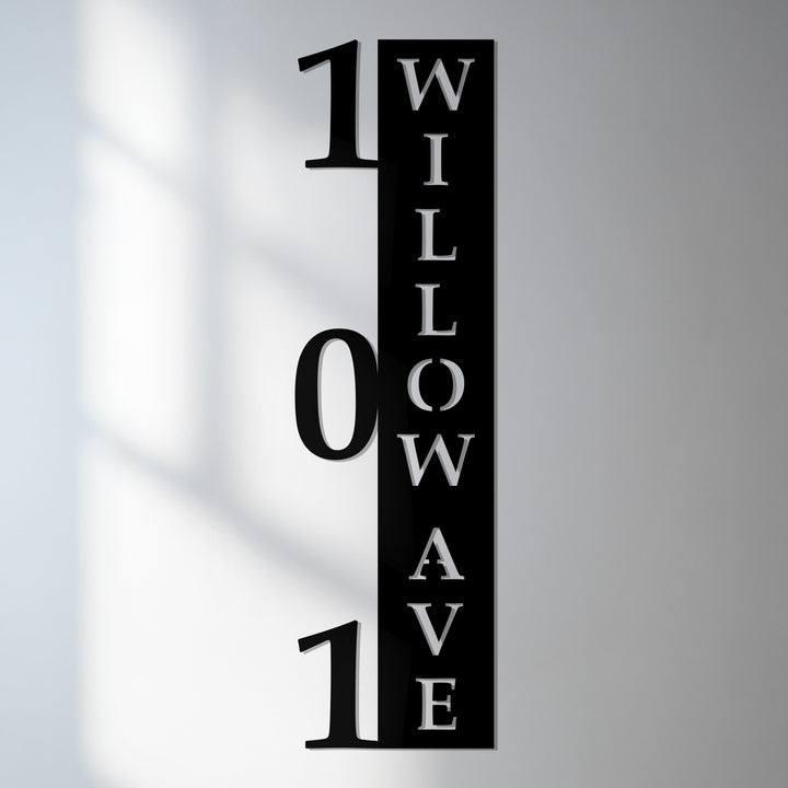 Vertical metal house numbers with welcome sign