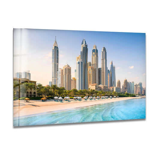 Gentle curves of teal water and soft sand offset the angular architecture, creating stunning home decor in this Dubai beach skyline glass wall art.