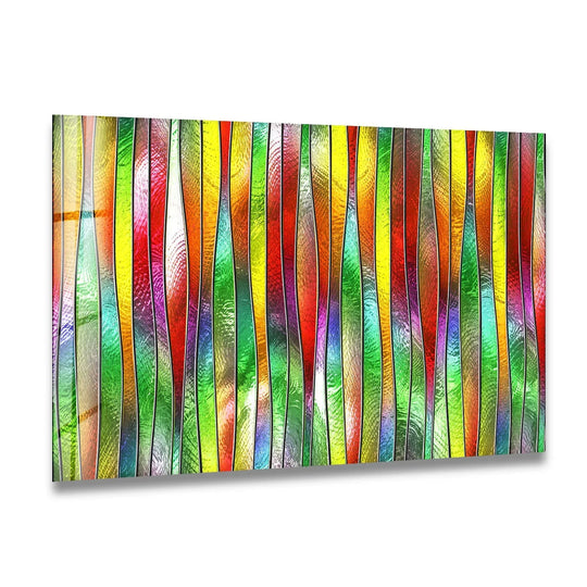 Abstract glass wall art decor features vertical wavy stripes of vibrant, blended colors with a textured, light-refracting surface.