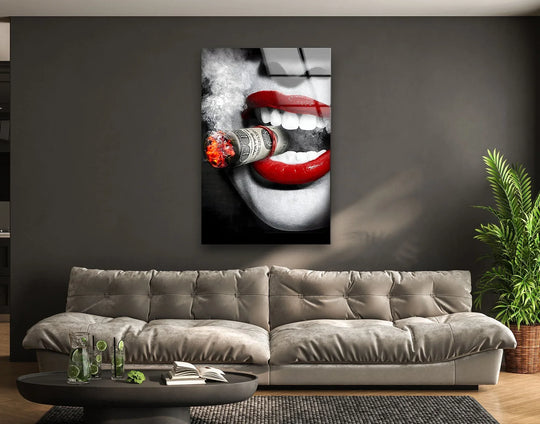 Bold red lips and a burning dollar bill cigar create striking color contrast in this unique modern wall decor.