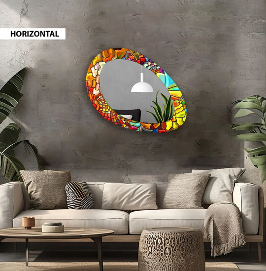 The textured gray background highlights the vibrant, red-stained dining room decorative mirror, adding depth to this modern, asymmetrical wall art piece.