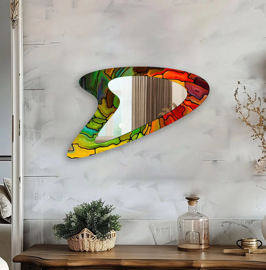 Textured surface of the decorative red stained small wall bathroom mirror shows a mosaic-like design with distinct color boundaries.