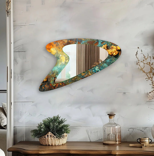 Rough surface texture defines the irregular framed wall mirror, enhancing its green abstract aesthetic with an intriguing combination of rust and verdigris.