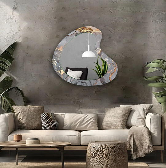 Softly reflecting the serene living space, this asymmetric wall mirror features grey and gold alcohol ink accents, enhancing the bathroom mirror design.
