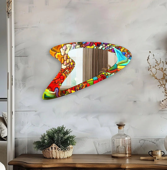 Showcasing a red stained irregular art from glass construction, this decorative wall mirror reflects impeccable craftsmanship and vibrant colors.