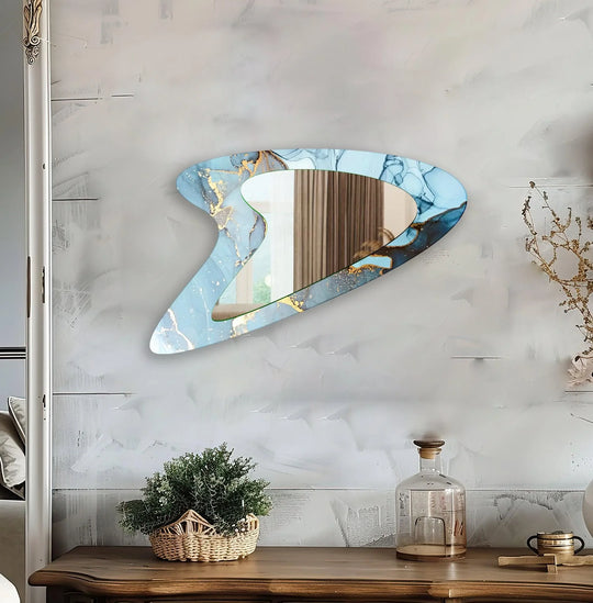 Blue Gold Abstract Glass Wall Mirror with an asymmetric shape and fluid art design displaying vibrant blue and golden hues on a wall