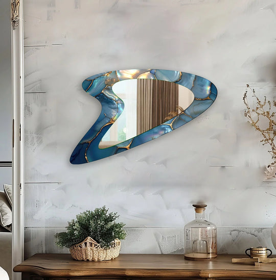 Flowing like a river, the blue abstract elegant decorative wall mirror features asymmetrical stained glass wall mirror accents that create a dynamic sense of movement.