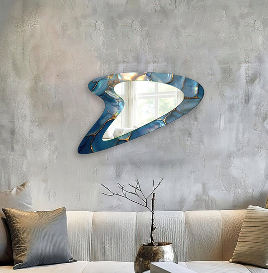 Horizontally oriented, amoeba-shaped decorative mirror showcases a blue abstract design with elegant marbling details, perfect as a decorative mirror for your entryway.