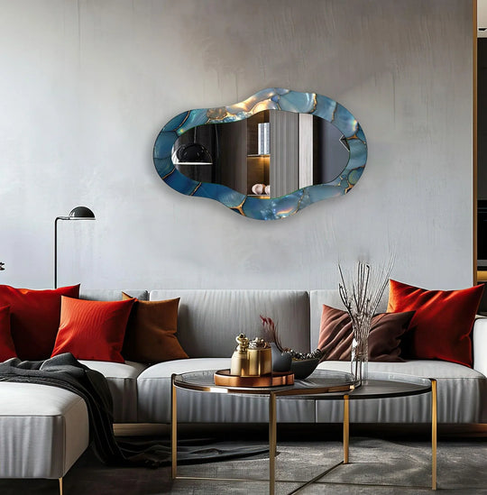 Highlighting the layering effect, the asymmetrical wall mirror features a striking blue metallic frame, creating a decorative bathroom mirror with depth and texture.