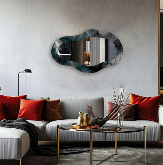 High color contrast defines this gray living room modern mirror with its dark, cloud-like asymmetric border reflected against the room's neutral tones.