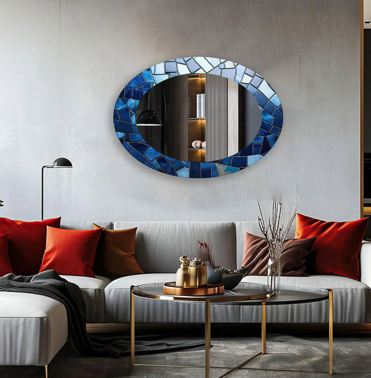 Showing the layering effect in this oval wall mirror, its blue mosaic tiles form a captivating modern mirror with a unique decorative look.