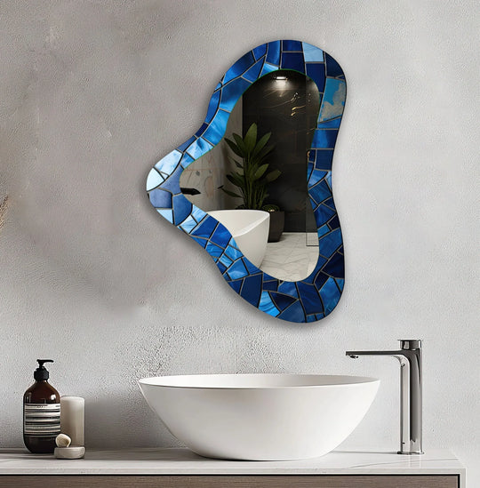 Highlighting the organic forms, this blue decorative irregular glass wall mirror features a mosaic style that adds unique home decor.
