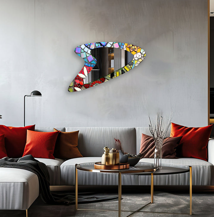 Mirror wall decor combining bold shapes and reflective surfaces to create a striking focal point
