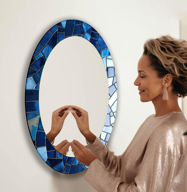 Mirror wall art with abstract shapes and reflective surfaces for a modern artistic vibe
