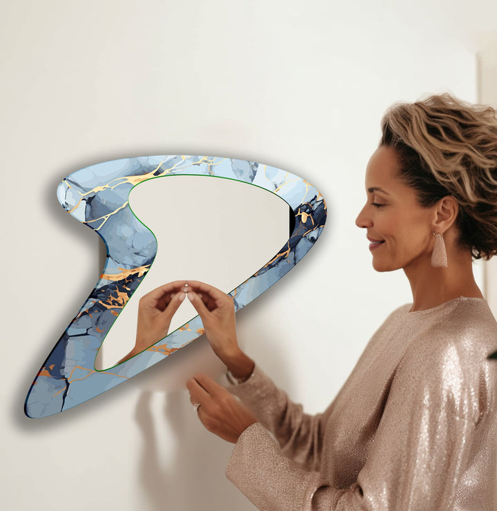 Mirror wall art with abstract shapes and reflective surfaces for a modern artistic vibe
