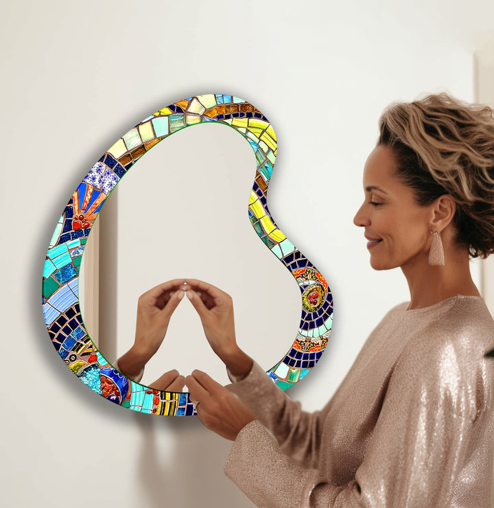 Wall mirrors with artistic frames that serve as both functional and decorative pieces

