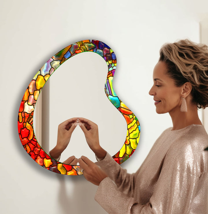 Decorative wall mirror blending artistic patterns with modern functionality for a unique look
