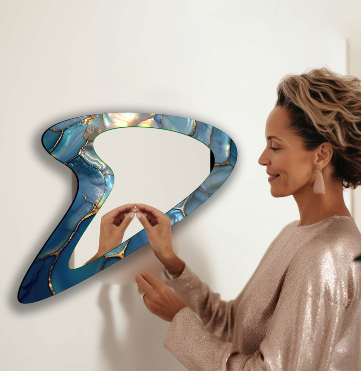 Wall mirrors with artistic frames that serve as both functional and decorative pieces
