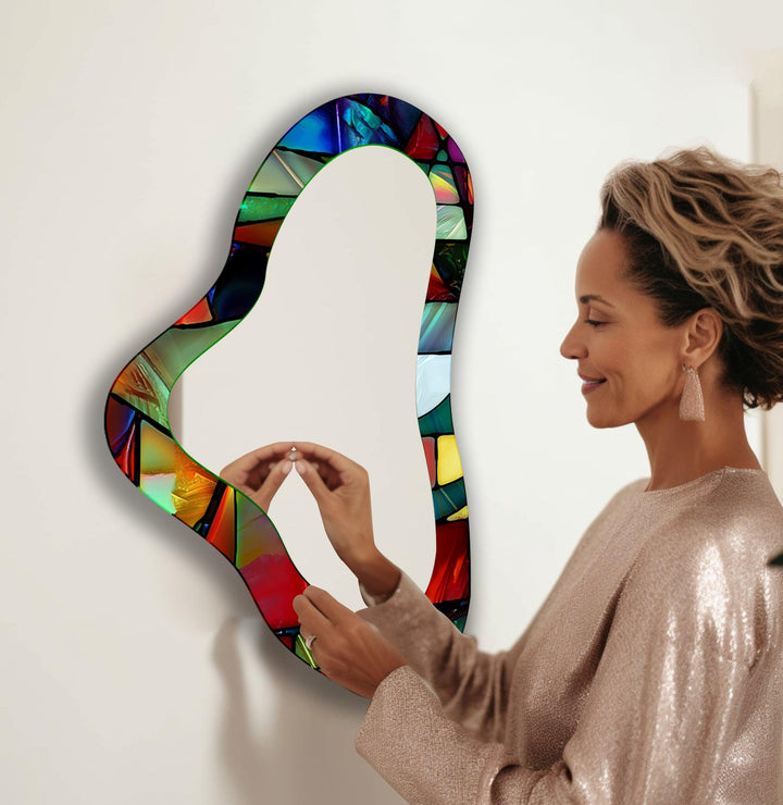 Decorative wall mirror blending artistic patterns with modern functionality for a unique look
