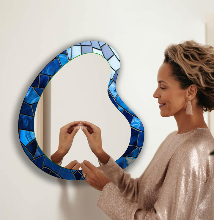 Wall mirrors with artistic frames that serve as both functional and decorative pieces

