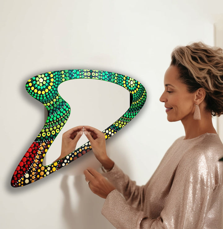 Decorative wall mirror blending artistic patterns with modern functionality for a unique look
