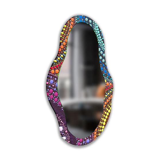 Multicolored framed wall mirror artfully displays a captivating spectrum of colors in an asymmetrical mosaic design, creating a vibrant focal point.