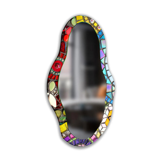 Vertically oriented, abstract-shaped mosaic asymmetrical wall mirror showcases an artful design, offering a unique spin on modern wall mirrors.