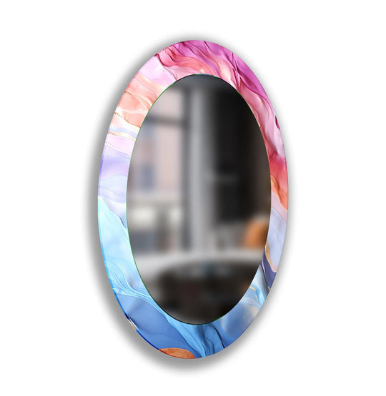 Negative space draws attention to the vibrant pink and blue abstract art surrounding the oval framed wall mirror, creating a modern home decoration piece.