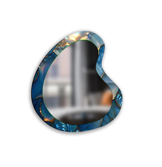 An asymmetric mirror features a blue abstract irregular design with shimmering gold lines an elegant artistic decor piece with a glass surface