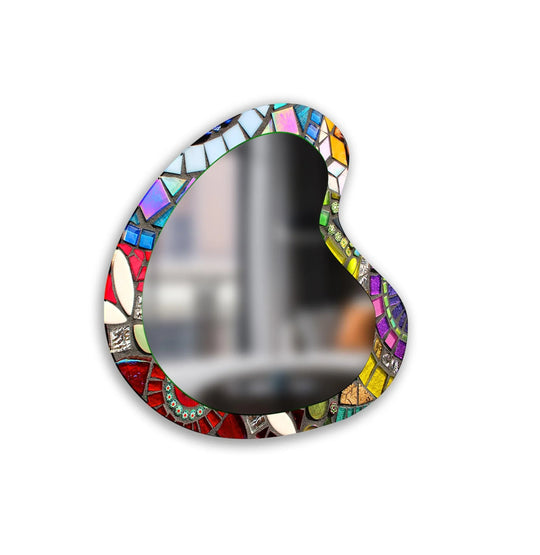 Showcasing decorating with wall mirrors, the colorful mosaic asymmetrical glass wall mirror is the central subject in this eccentric, eye-catching piece.