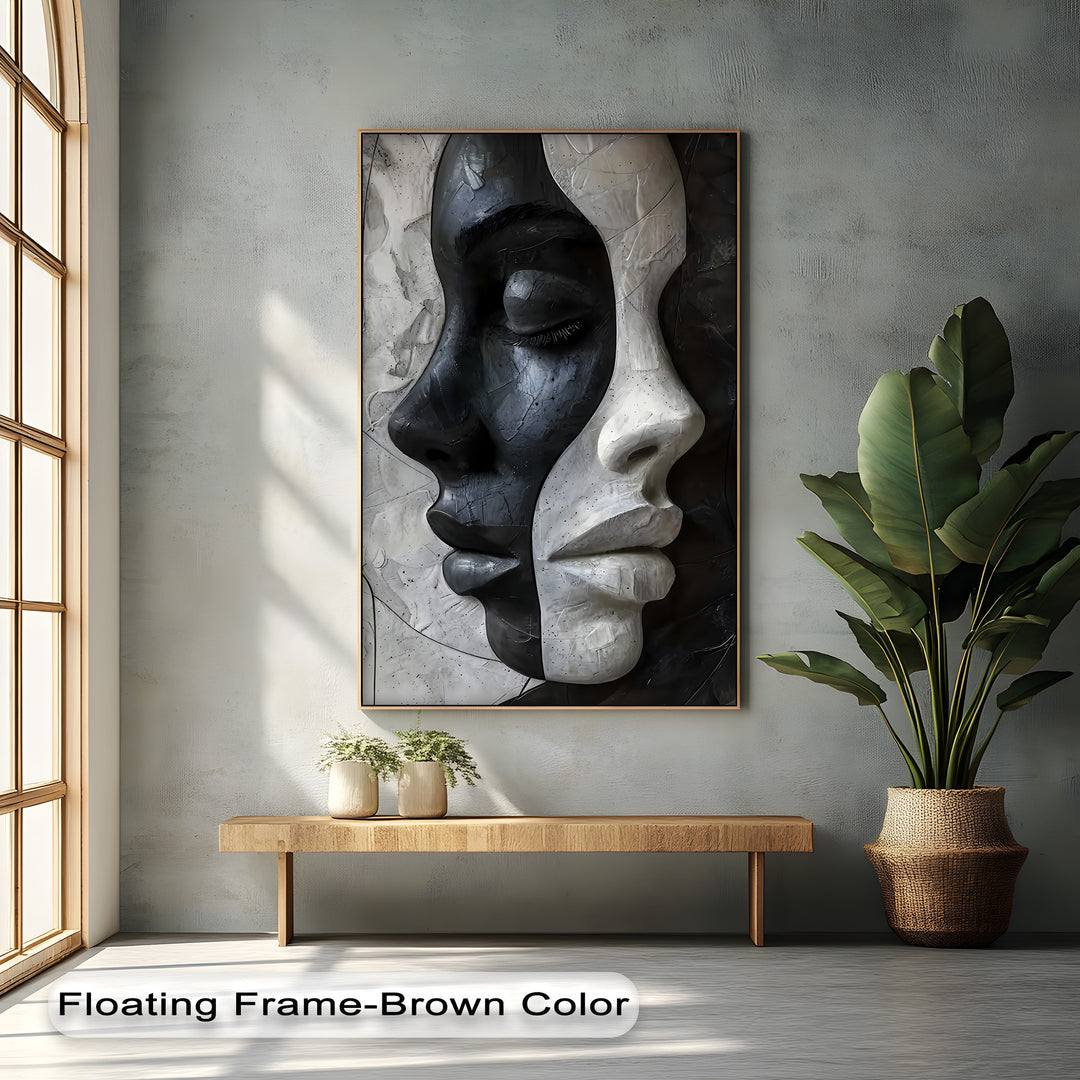 A textured light gray wall with subtle shadows provides a serene background for the striking Contrasting Faces canvas painting, complementing the modern wall art.